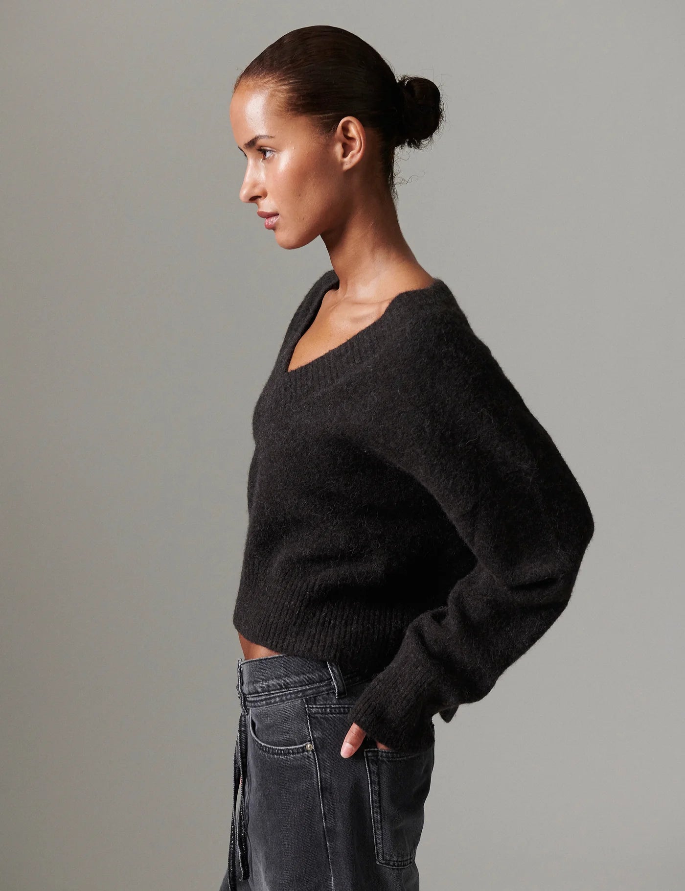 v neck jumper dark brown wool jumper with rib detailing and oversized fit side view
