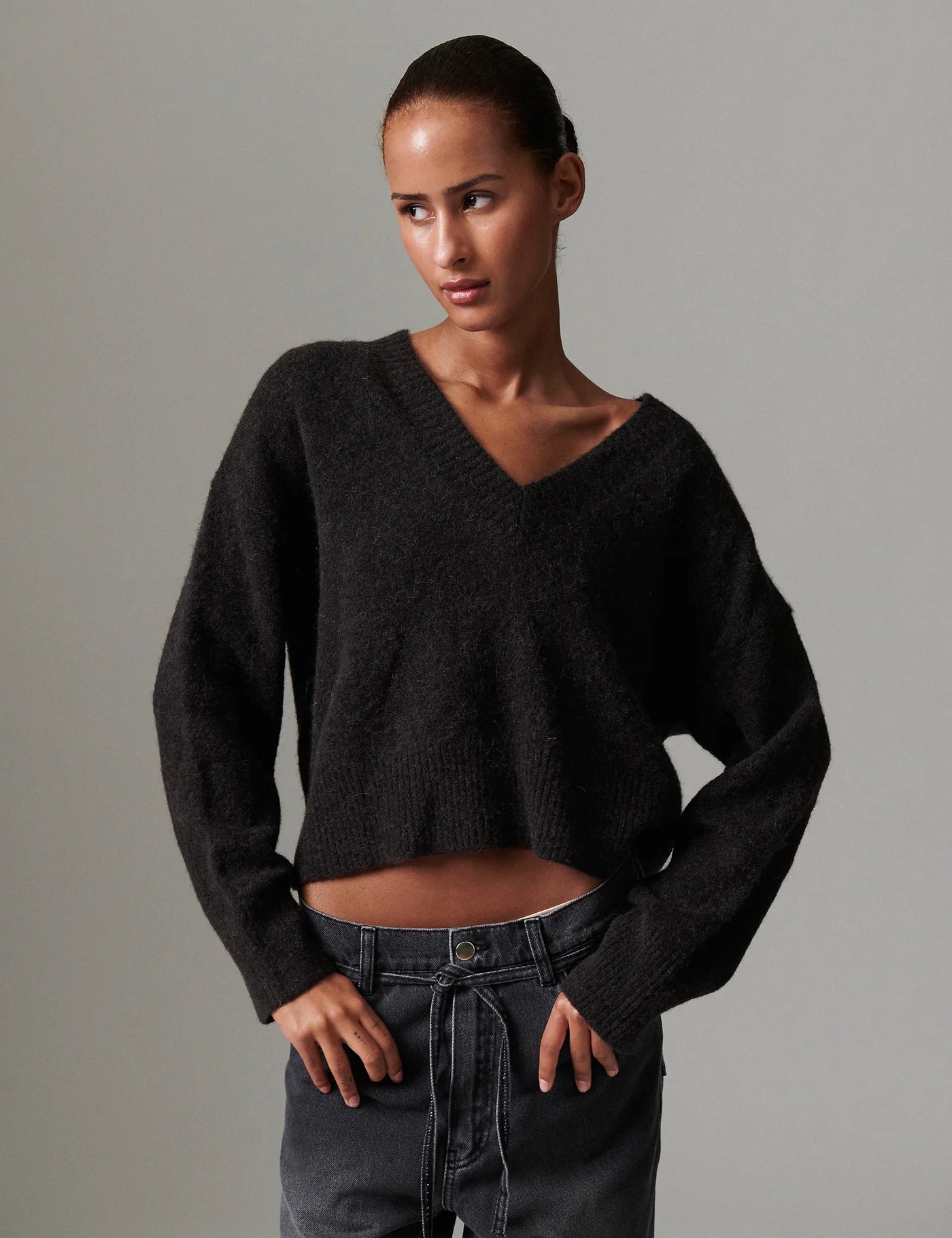 v neck jumper dark brown wool jumper with rib detailing and oversized fit model shot