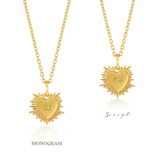 gold spiky heart with red stone inside on a gold chain from rachel jackson flip side