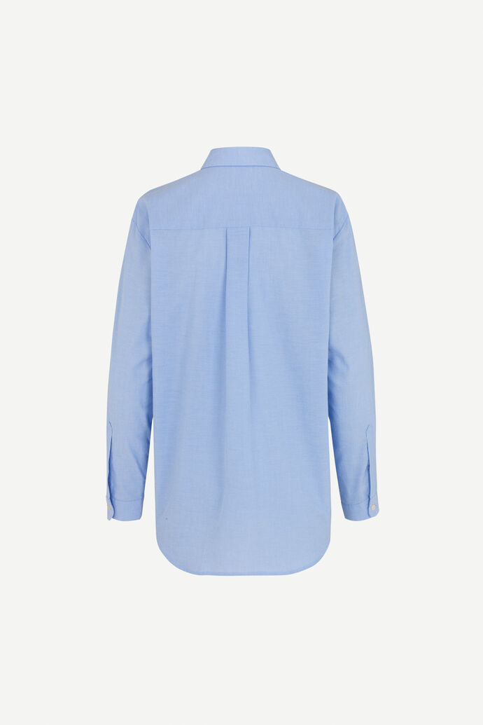 Light blue cotton shirt with long sleeves and full length hidden placket with button fastening