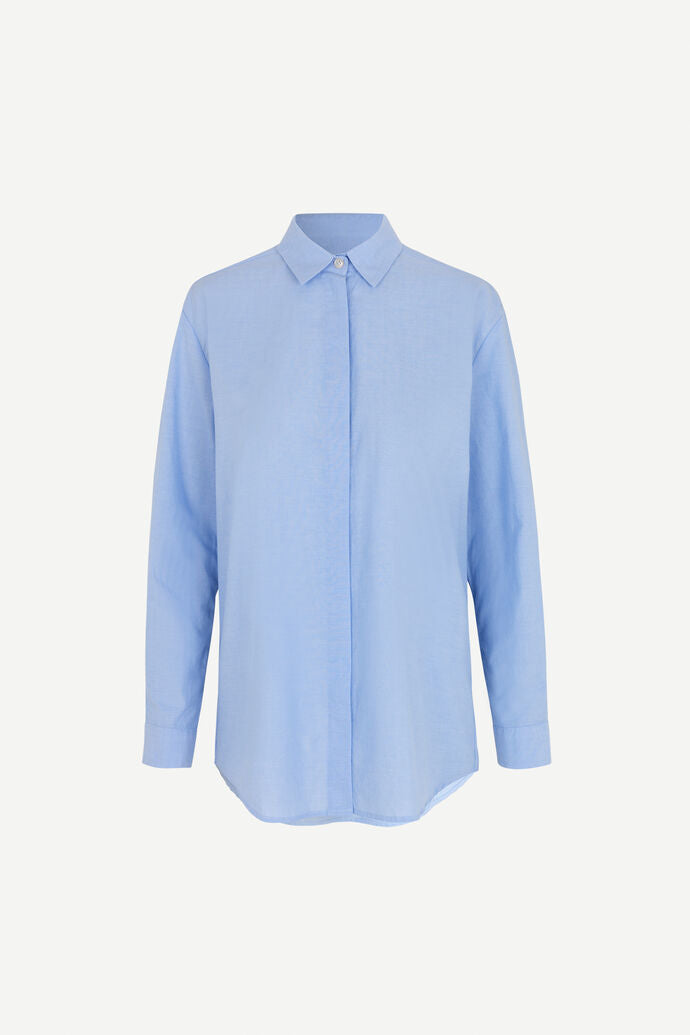 Light blue cotton shirt with long sleeves and full length hidden placket with button fastening