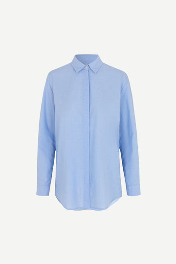 Light blue cotton shirt with long sleeves and full length hidden placket with button fastening