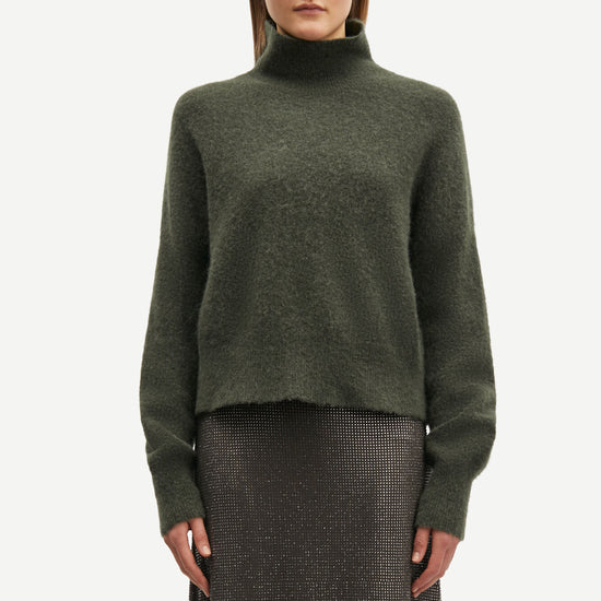 dark green turtle neck jumper