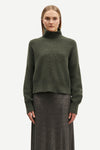 dark green turtle neck jumper