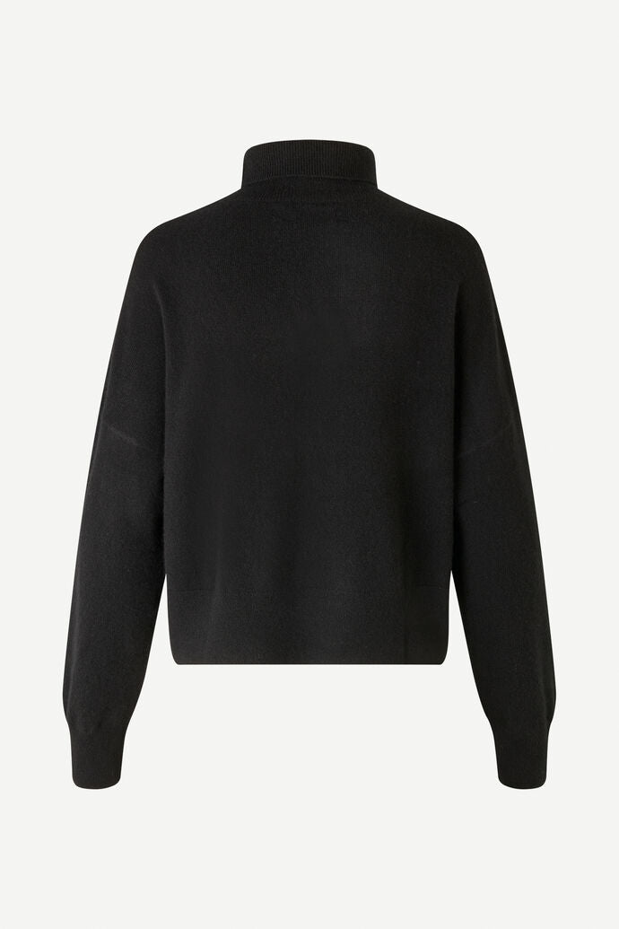Black turtleneck cashmere jumper with long dropped sleeves and ribbed hem and cuffs