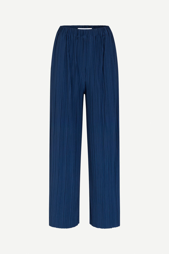 Navy blue wide leg trousers with elasticated waist and a crinkle effect fabric