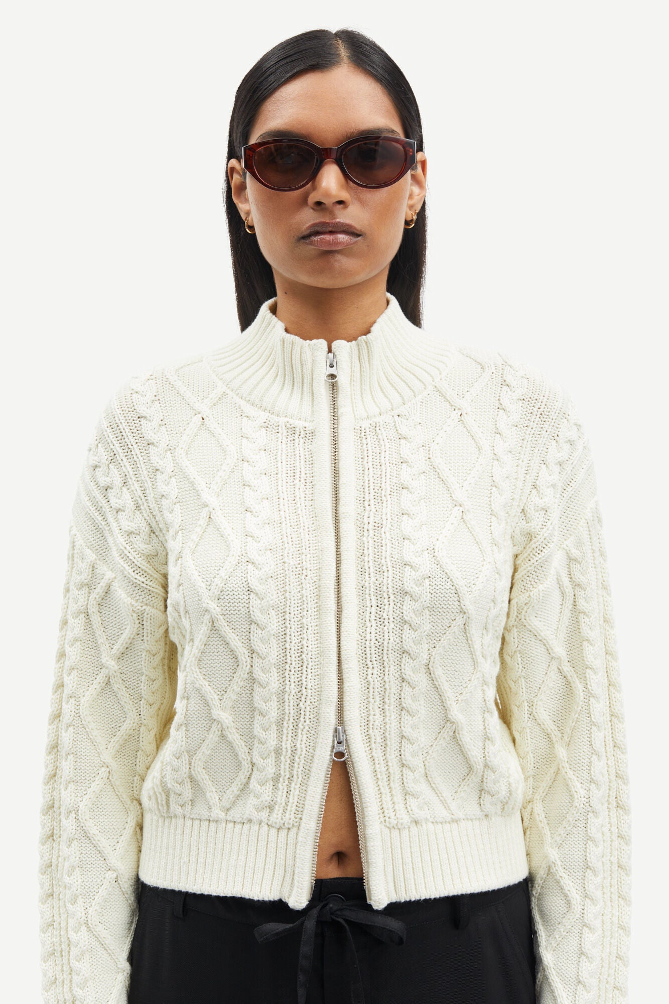 Chunky cream cardigan with two way zip and turtleneck with arron styling and cropped length