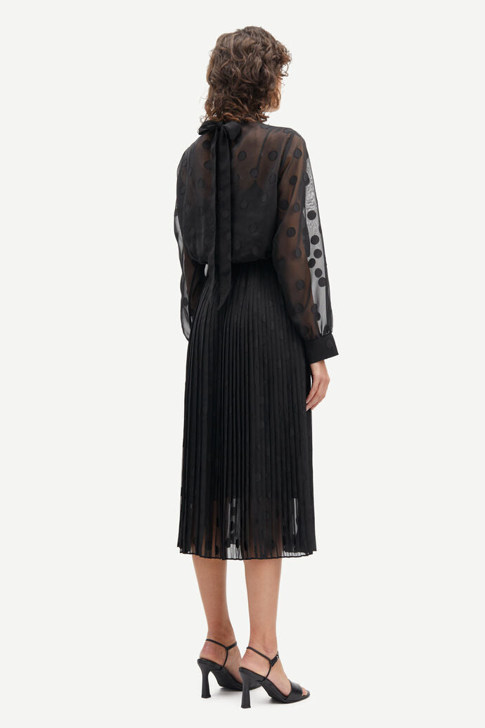 High neck chiffon midi dress with long sheer sleeves and applique dots with pleated skirt