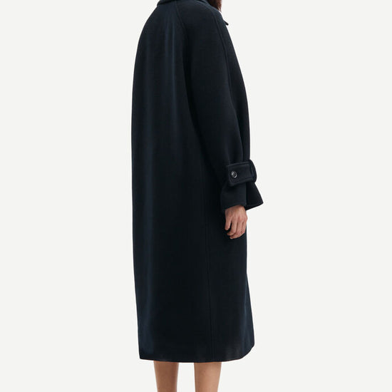 Navy woollen coat with classic collar and wide sleeves with cuff belts