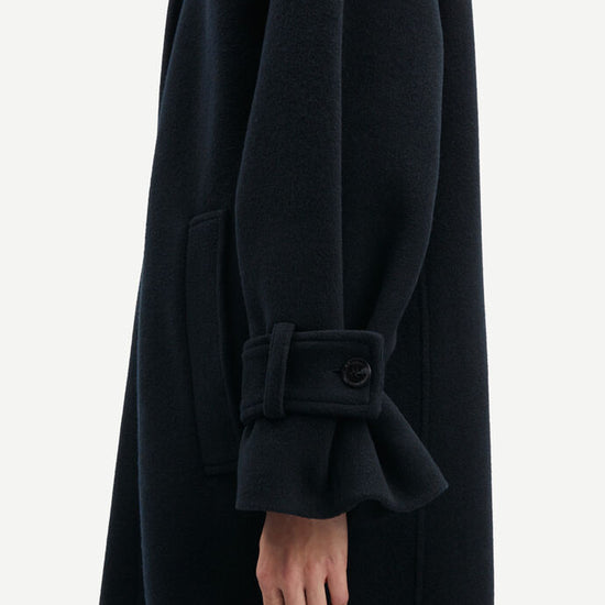 Navy woollen coat with classic collar and wide sleeves with cuff belts