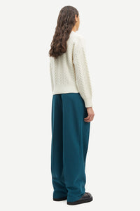 Crew neck cable knit wool jumper in ecru with dropped shoulders and ribbed cuffs