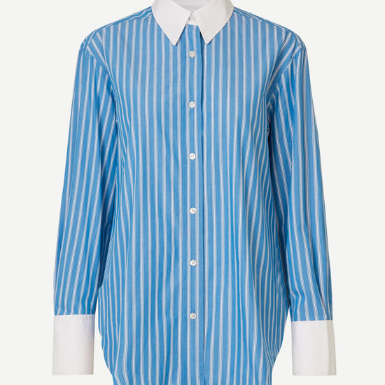 Blue and white vertical striped shirt with classic shirt features and white cuffs and collar