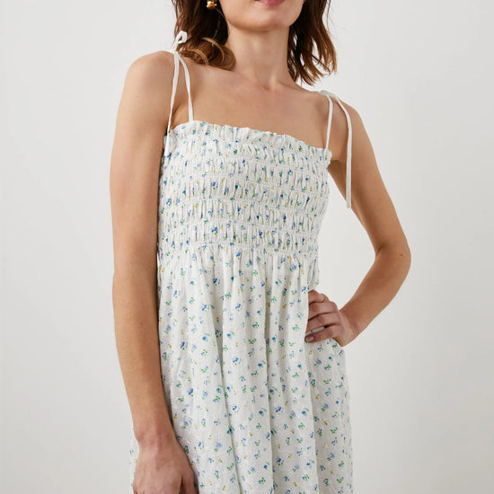 Thin strapped summer dress in white with ditsy florals and a ruched bodice midi in length