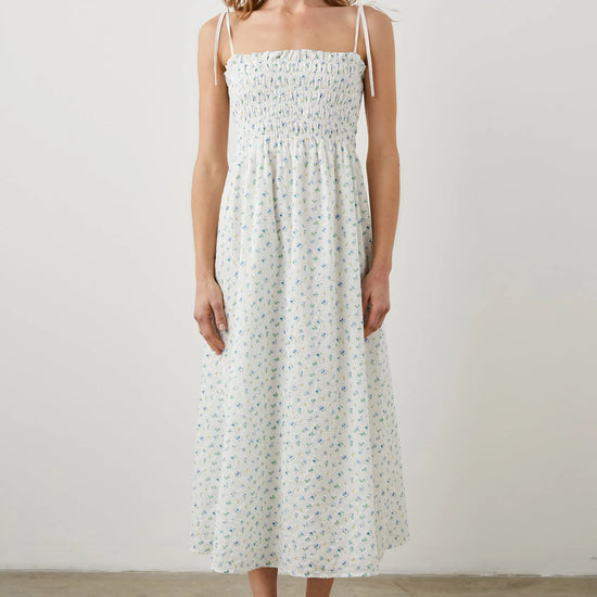 Thin strapped summer dress in white with ditsy florals and a ruched bodice midi in length