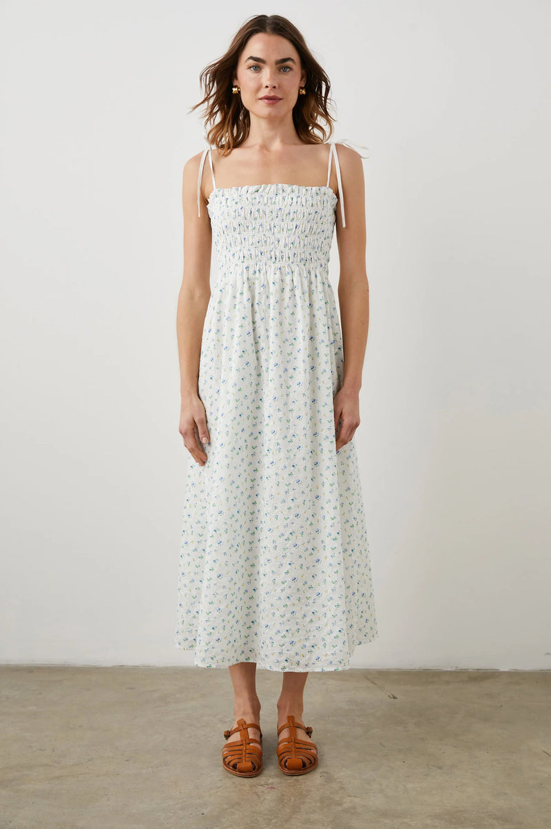Thin strapped summer dress in white with ditsy florals and a ruched bodice midi in length