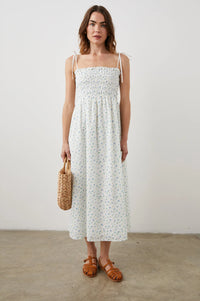 Thin strapped summer dress in white with ditsy florals and a ruched bodice midi in length