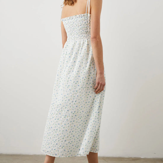 Thin strapped summer dress in white with ditsy florals and a ruched bodice midi in length