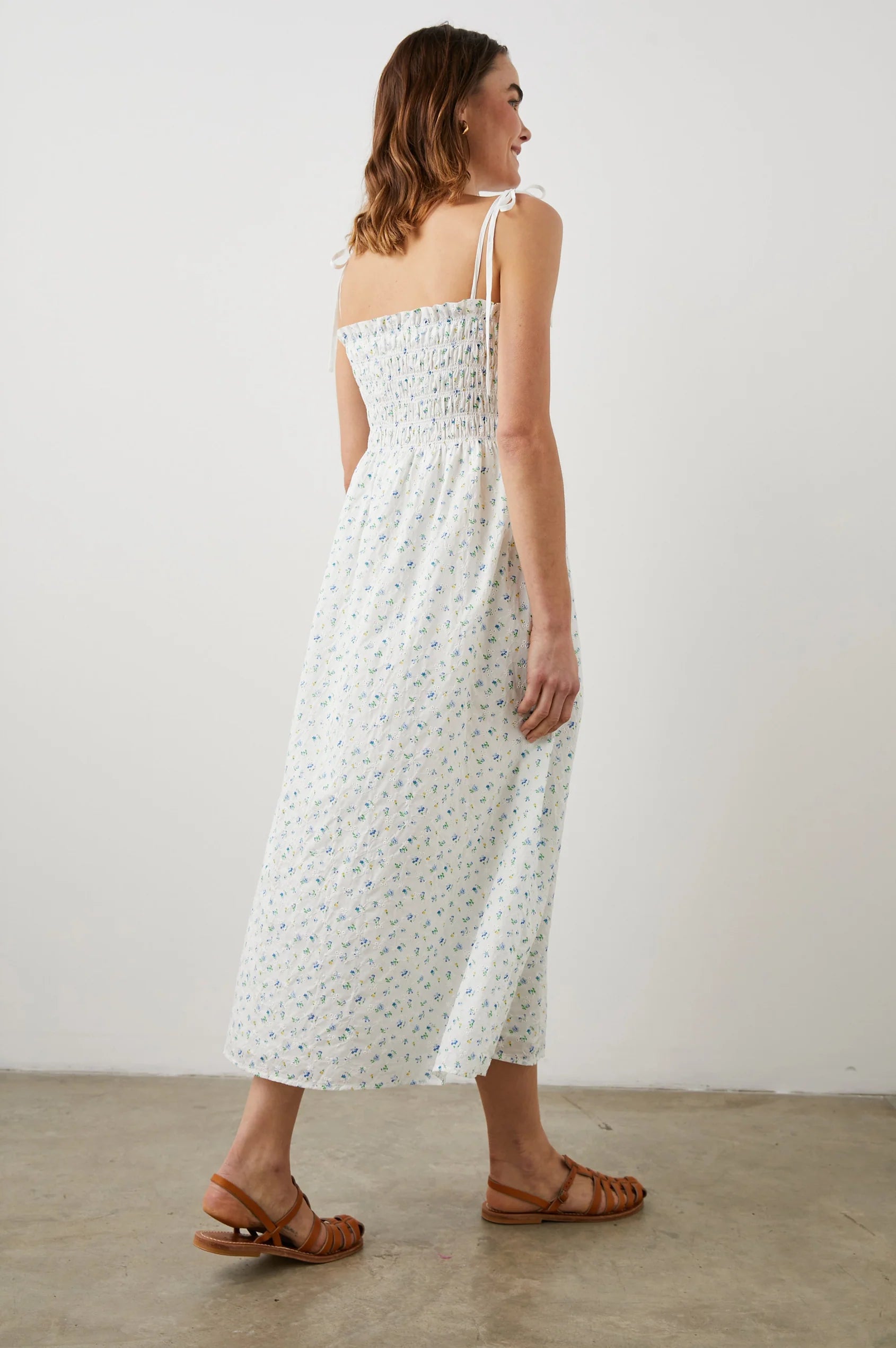 Thin strapped summer dress in white with ditsy florals and a ruched bodice midi in length