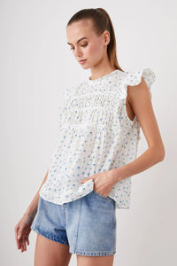 Capped sleeves white top with crew neck and pintuck features across the bust and light ruffle sleeves
