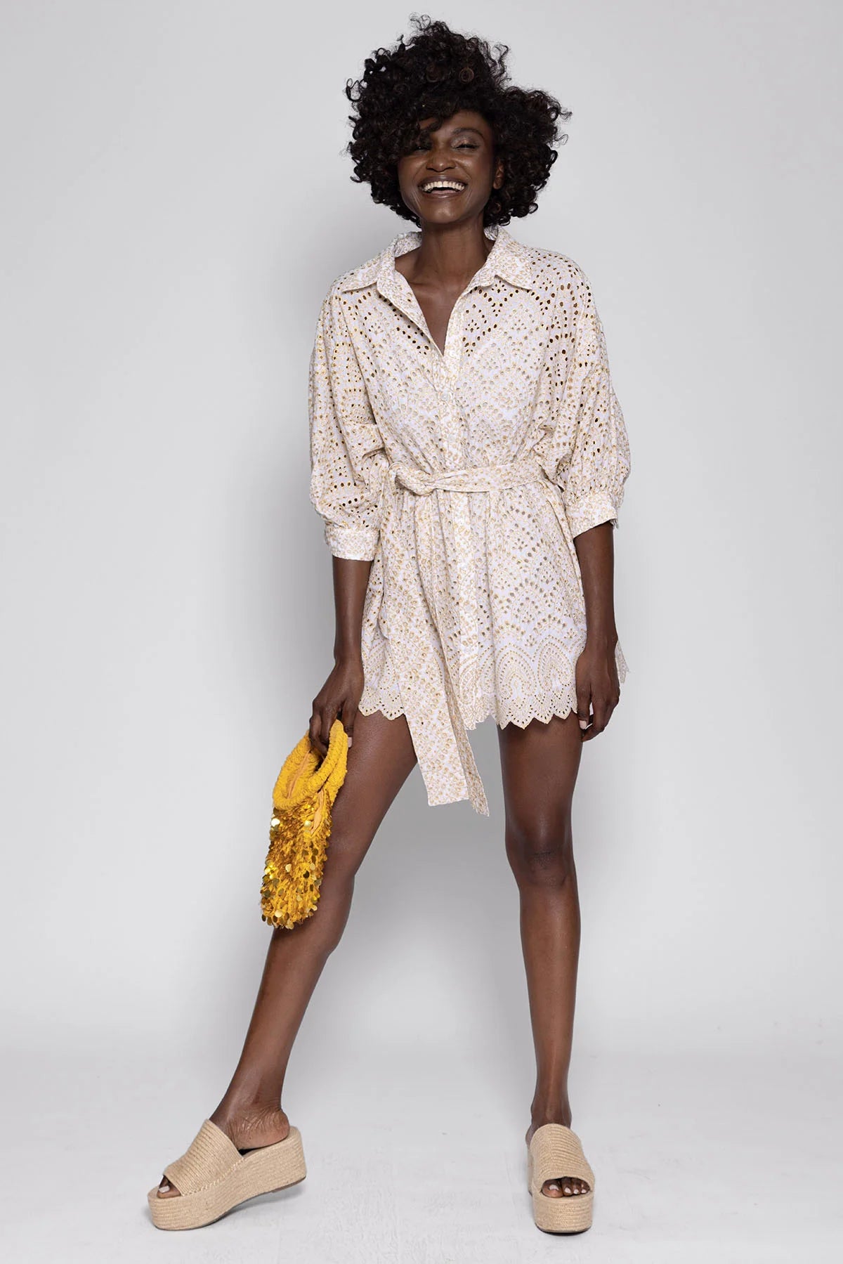 Short broderie anglais off-white shirt dress with three quarter length sleeves and classic collar with self tie fabric belt and removeable lining