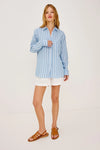 Woman wearing a blue and white Rails shirt striped shirt against a plain background whole outfit