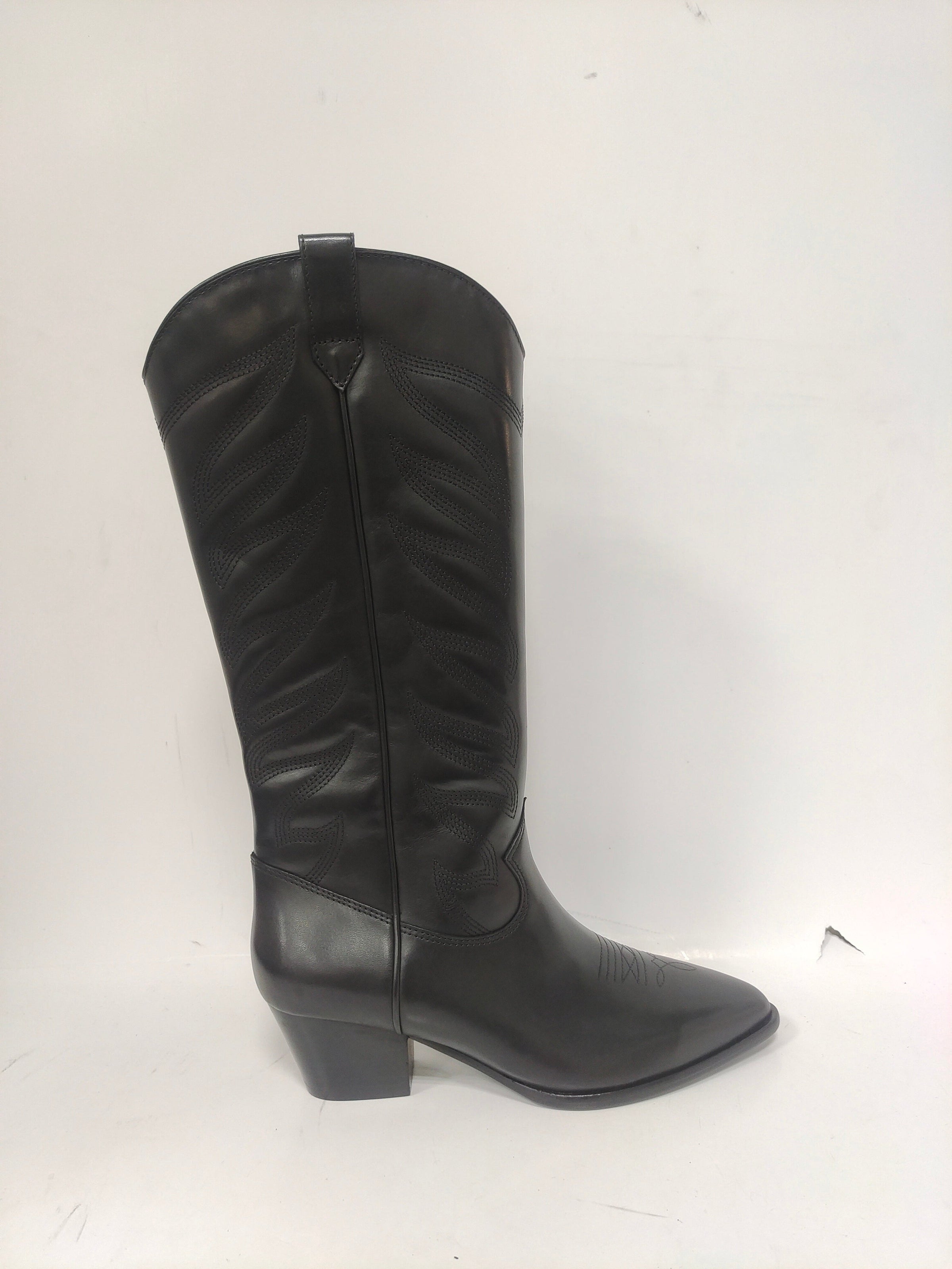 Tall black cowboy boots with quilted details on the shaft