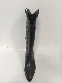 Tall black cowboy boots with quilted details on the shaft