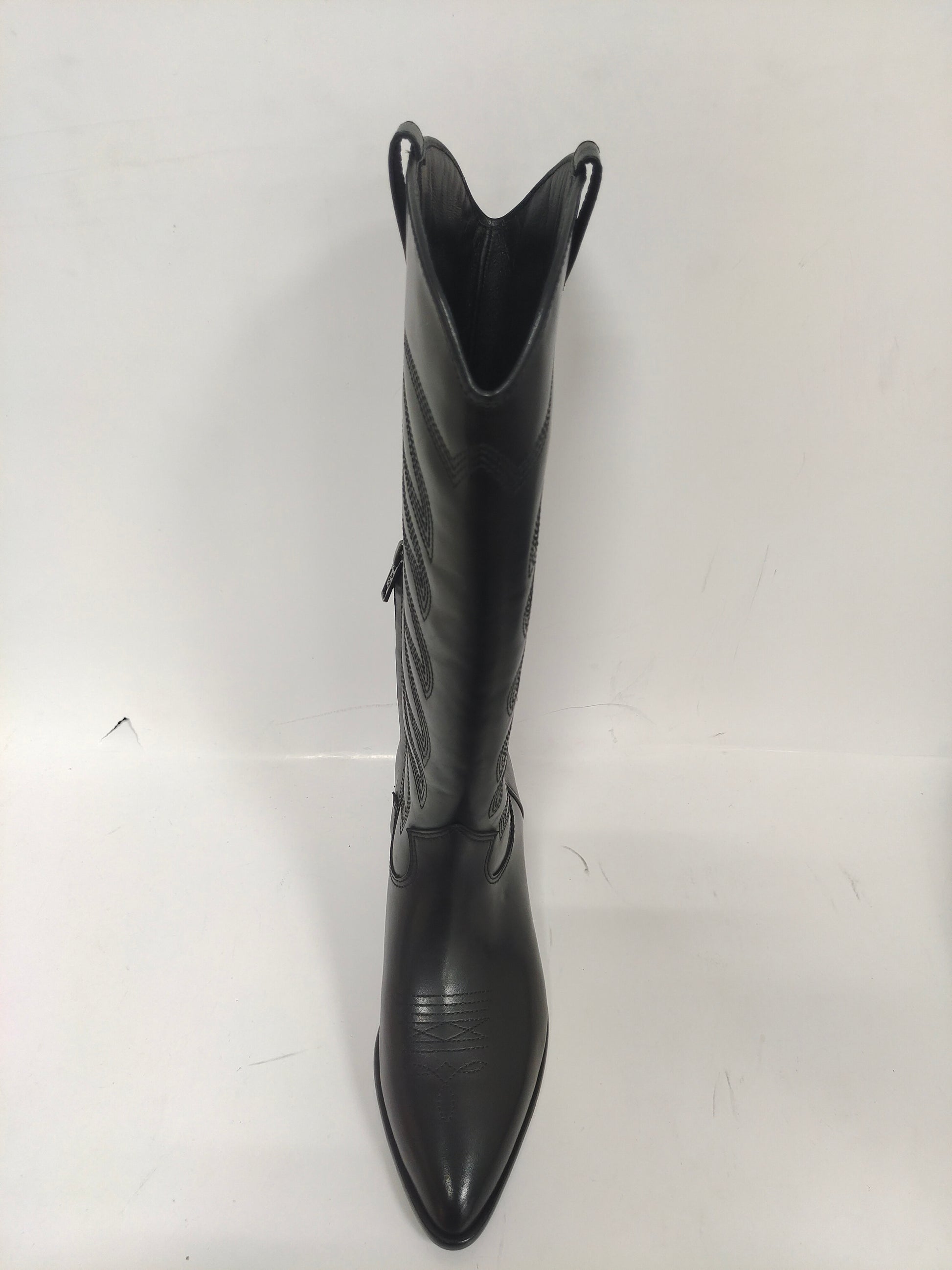 Tall black cowboy boots with quilted details on the shaft