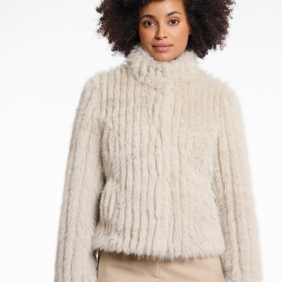 beige faux fur jacket with high neck, central closure and stripe detailing in the fur