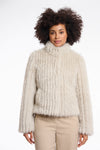 beige faux fur jacket with high neck, central closure and stripe detailing in the fur