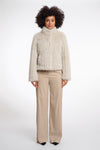 beige faux fur jacket with high neck, central closure and stripe detailing in the fur model shot 