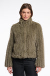 green faux fur jacket with central closure, high neck and stripe detailing in the fur