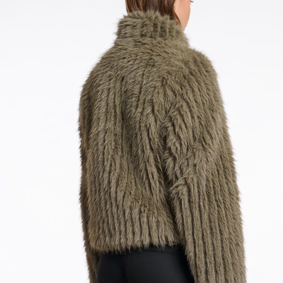 green faux fur jacket with central closure, high neck and stripe detailing in the fur rear view 