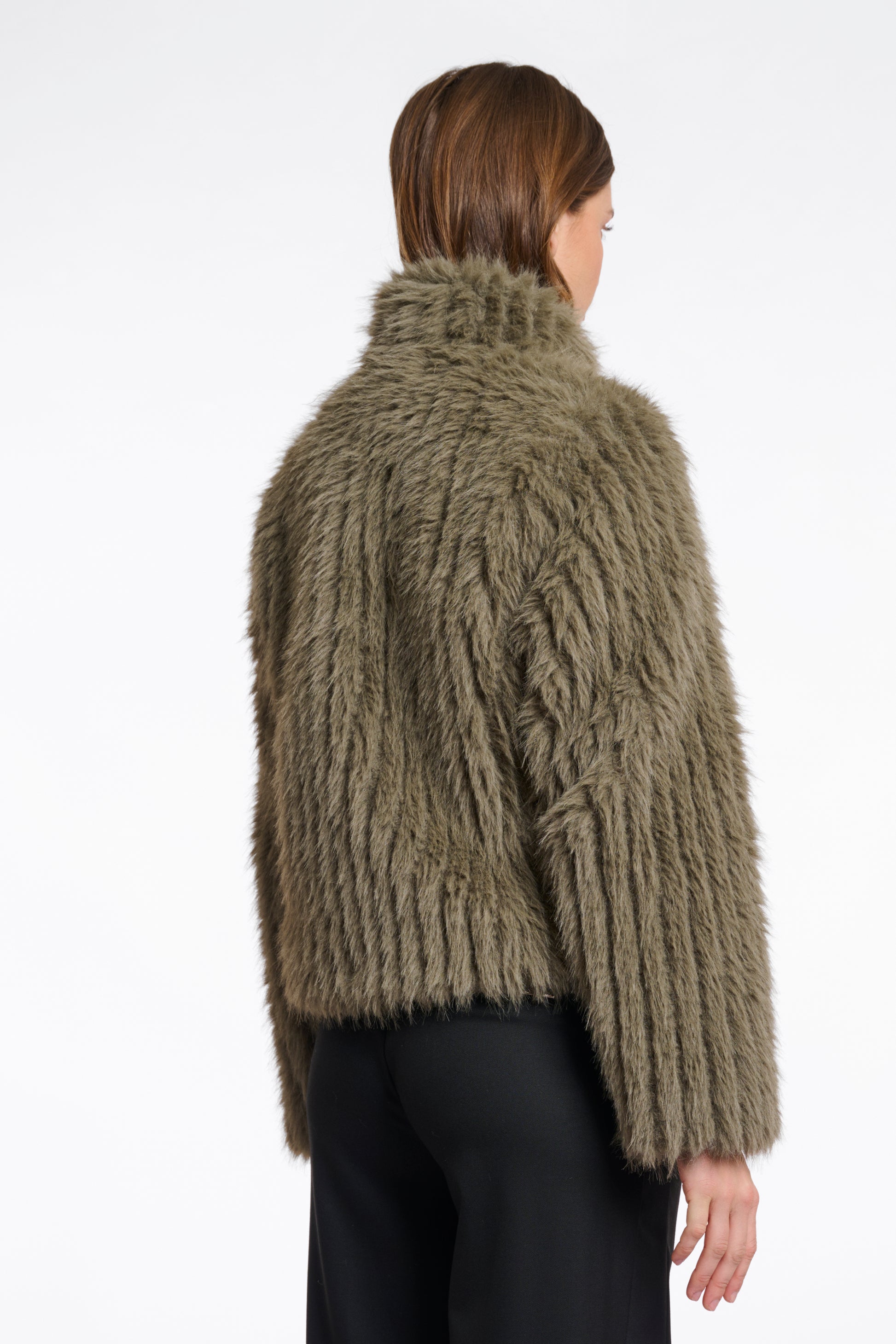 green faux fur jacket with central closure, high neck and stripe detailing in the fur rear view 