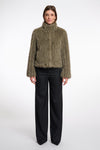 green faux fur jacket with central closure, high neck and stripe detailing in the fur model shot