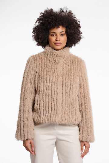 light beige faux fur jacket with high neck, central closure and stripe detailing in the fur