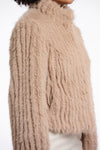 light beige faux fur jacket with high neck, central closure and stripe detailing in the fur side view 