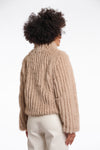  light beige faux fur jacket with high neck, central closure and stripe detailing in the fur rear view 