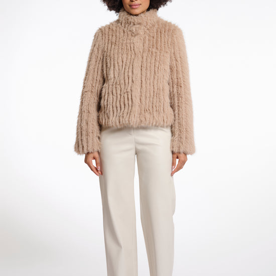 light beige faux fur jacket with high neck, central closure and stripe detailing in the fur model shot