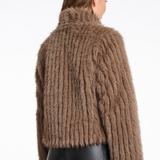 brown faux fur jacket with high neck, central closure and stripe detailing in the fur rear view 