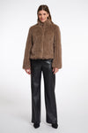brown faux fur jacket with high neck, central closure and stripe detailing in the fur model shot