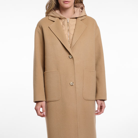 single breasted camel coat with interior quilted gilet and 2 patch pockets model shot