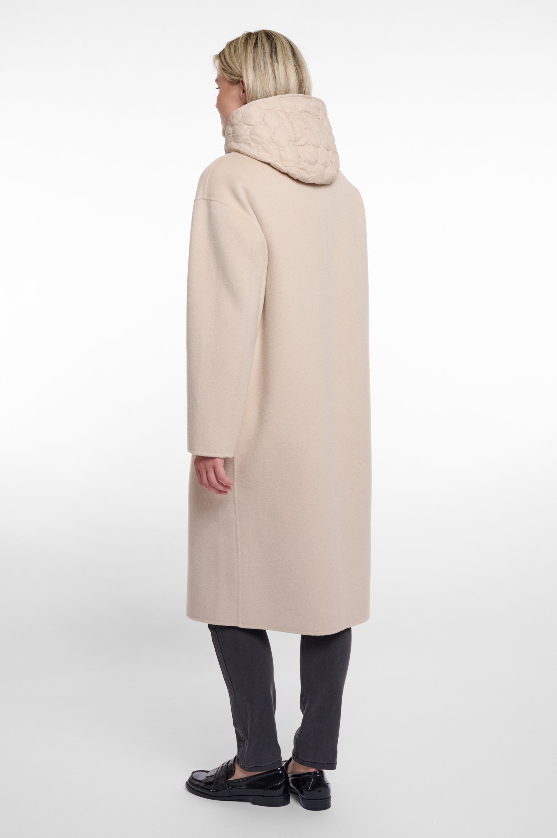 single breasted light beige coat with interior quilted gilet and 2 patch pockets  rear view