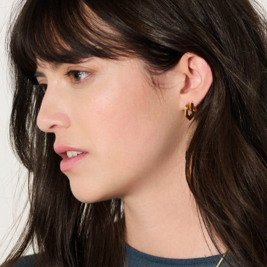 mini hexagon shaped gold hoop earrings from rachel jackson model shot