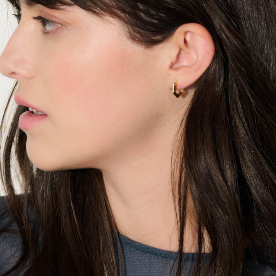 mini hexagon shaped gold hoop earrings from rachel jackson model shot