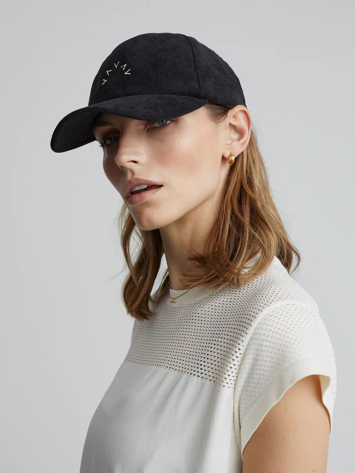 black cap with white Varley branding