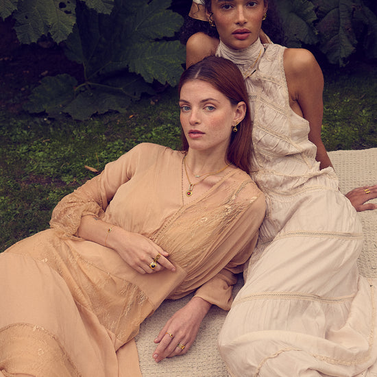 gold pendant heart necklace with red stone from rounded rectangular charm and gold chain from rachel jackson model shot