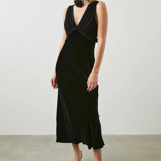 Black V neck dress with gathered strapless viscose and silk blend gathered top with ruffle empire line detailing and a straight velvet midi skirt