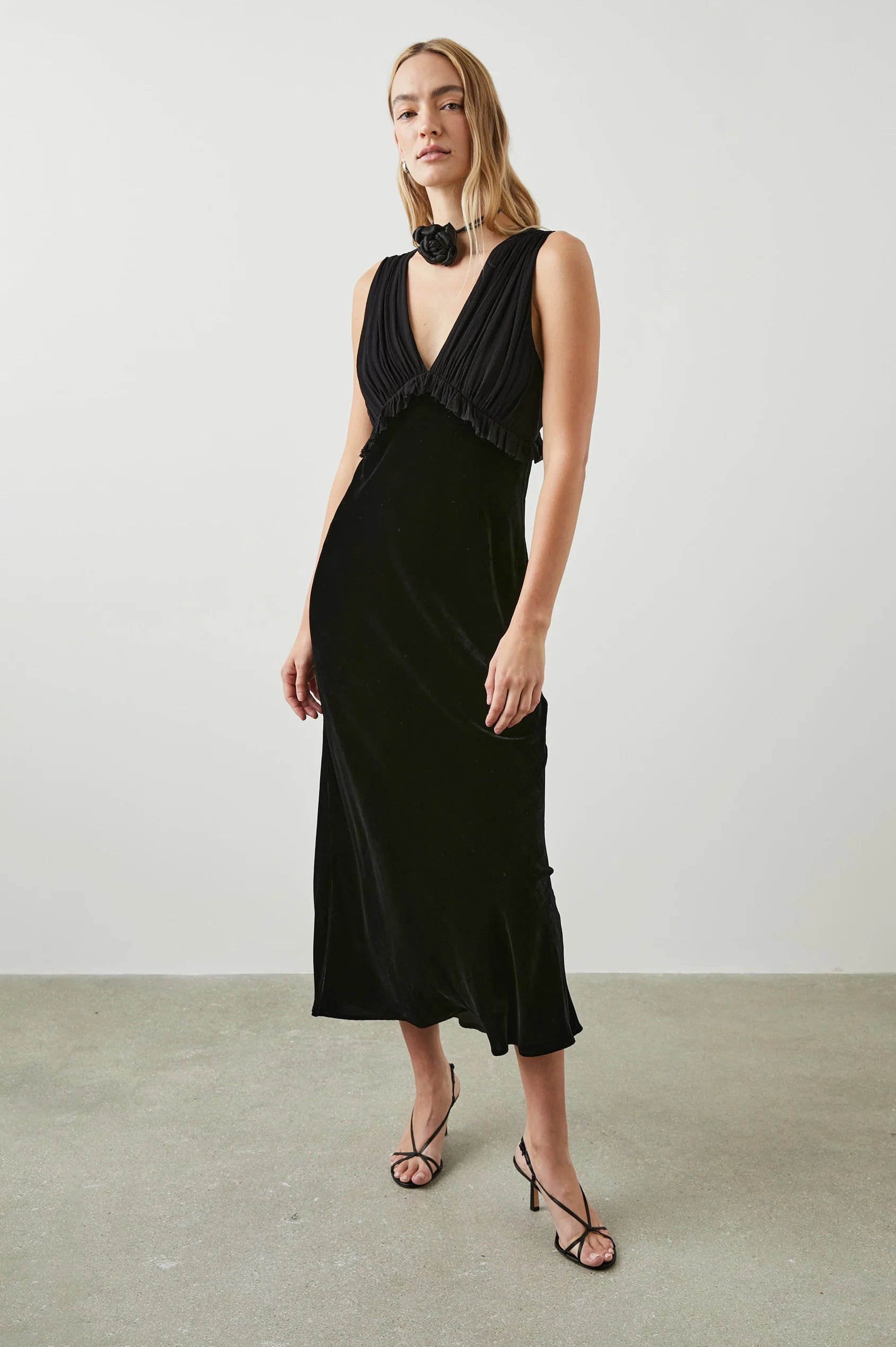 Black V neck dress with gathered strapless viscose and silk blend gathered top with ruffle empire line detailing and a straight velvet midi skirt