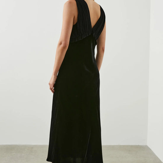 Black V neck dress with gathered strapless viscose and silk blend gathered top with ruffle empire line detailing and a straight velvet midi skirt